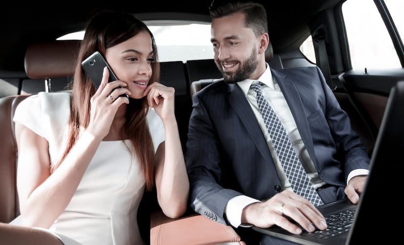 beautiful-business-woman-is-talking-mobile-phone-while-sitting-back-seat-car_252847-26824