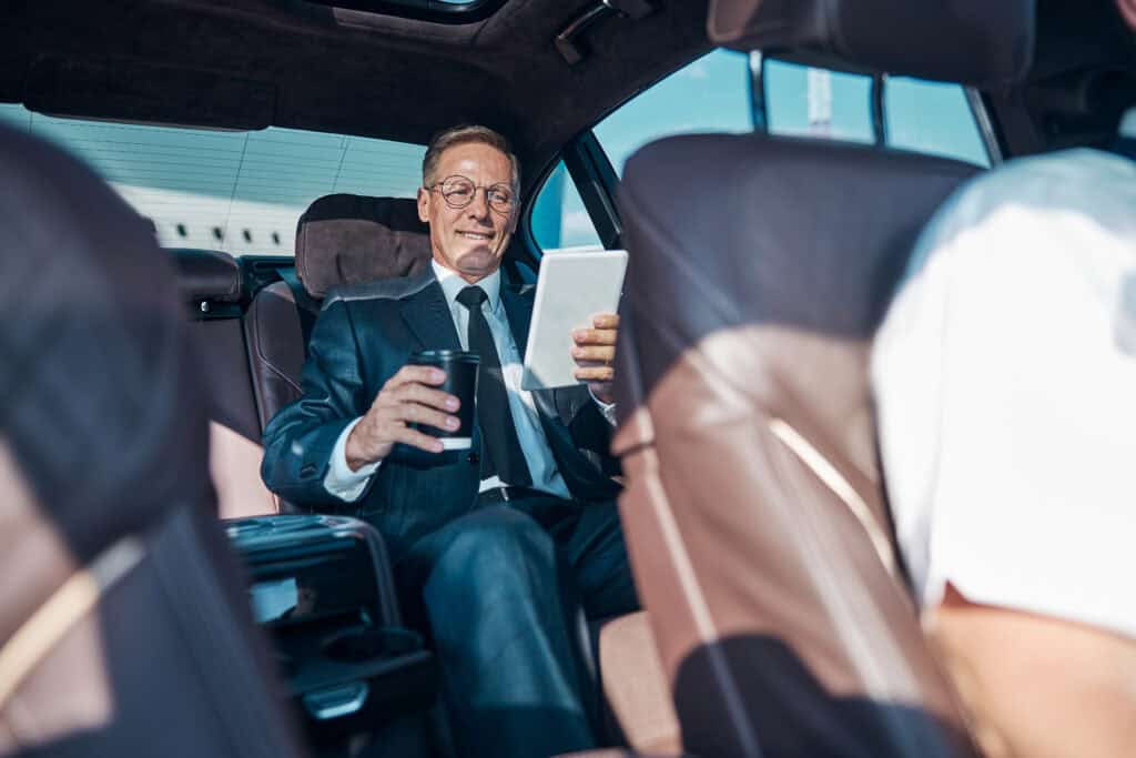 Luxury chauffeur service for business travelers in a premium vehicle.