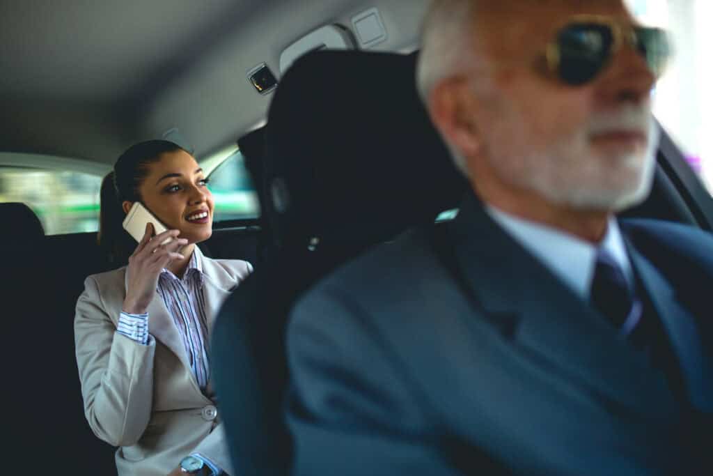 Luxury chauffeur service in a high-end vehicle with professional drivers.