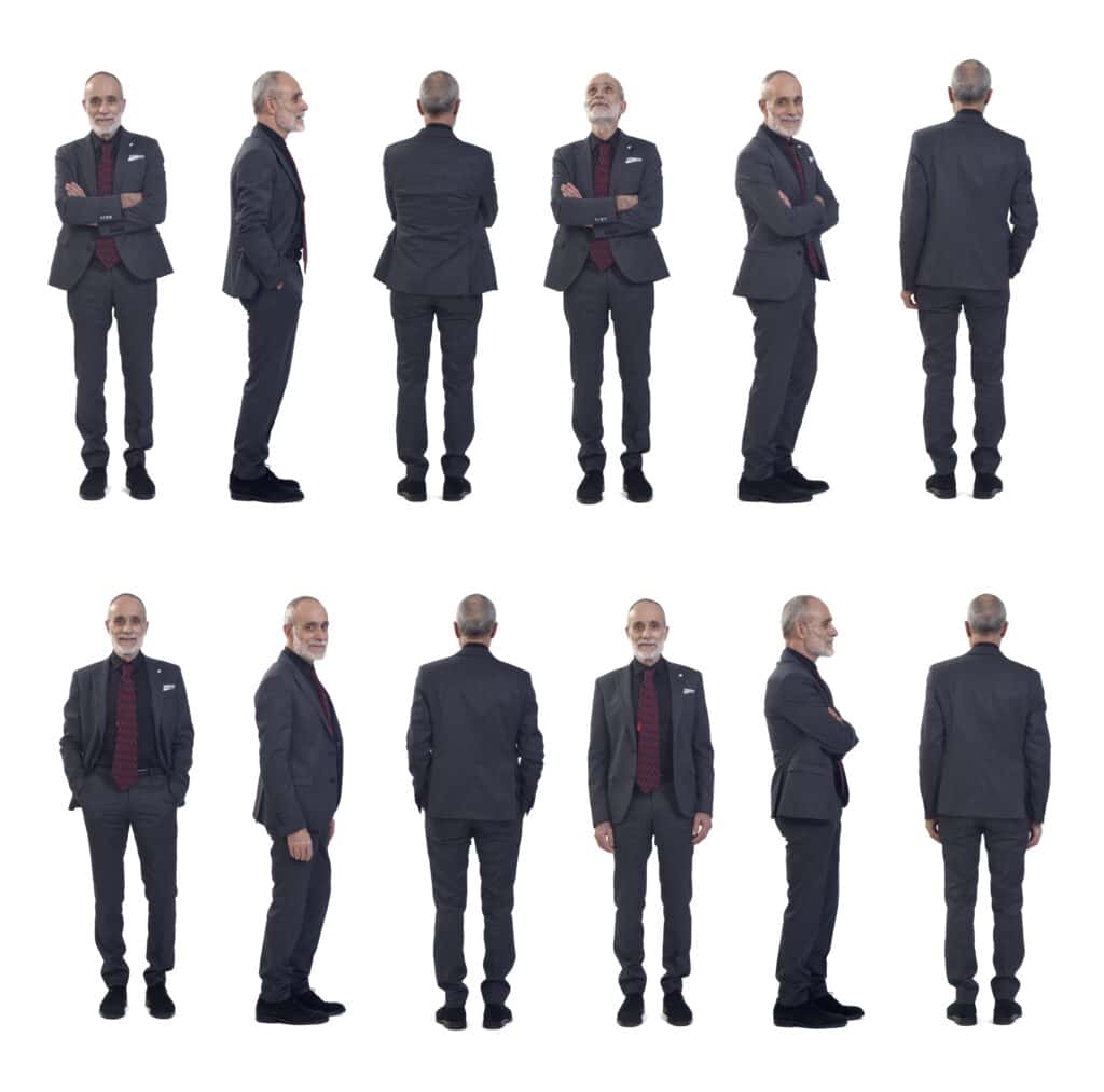 Chauffeur in formal suit standing confidently, showcasing professional luxury transportation.