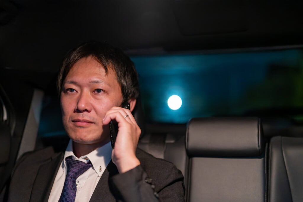 Luxury chauffeur service with professional driver in a high-end vehicle. Reliable transportation for.