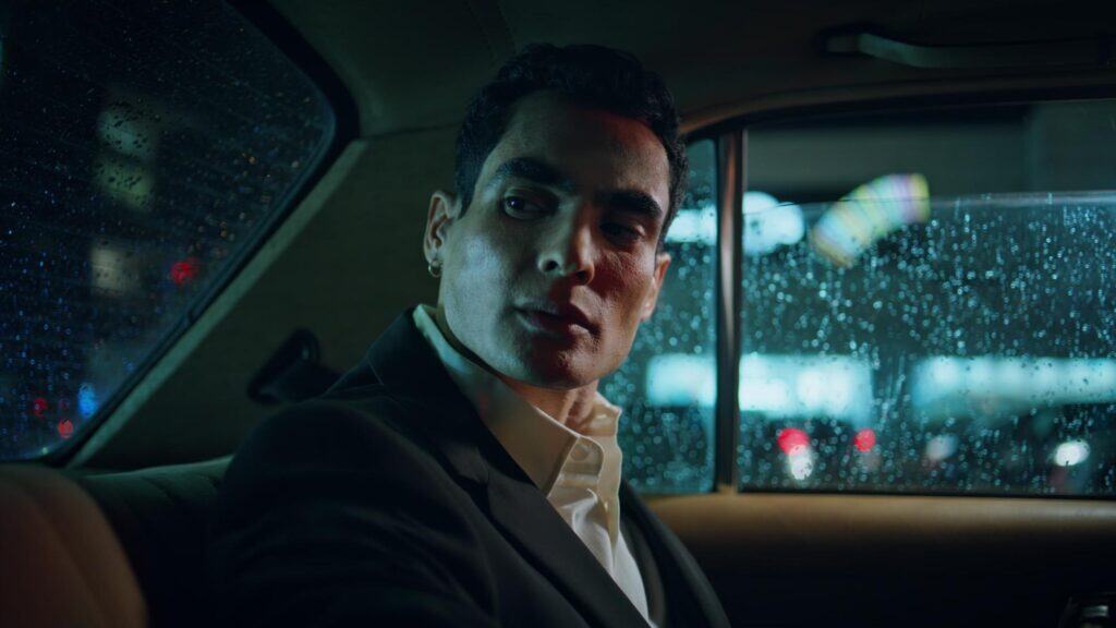 Professional chauffeur in luxury car for premium transportation services.