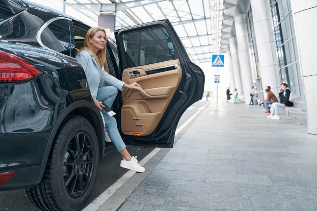Luxury chauffeur service at the airport with comfortable vehicle and professional driver.